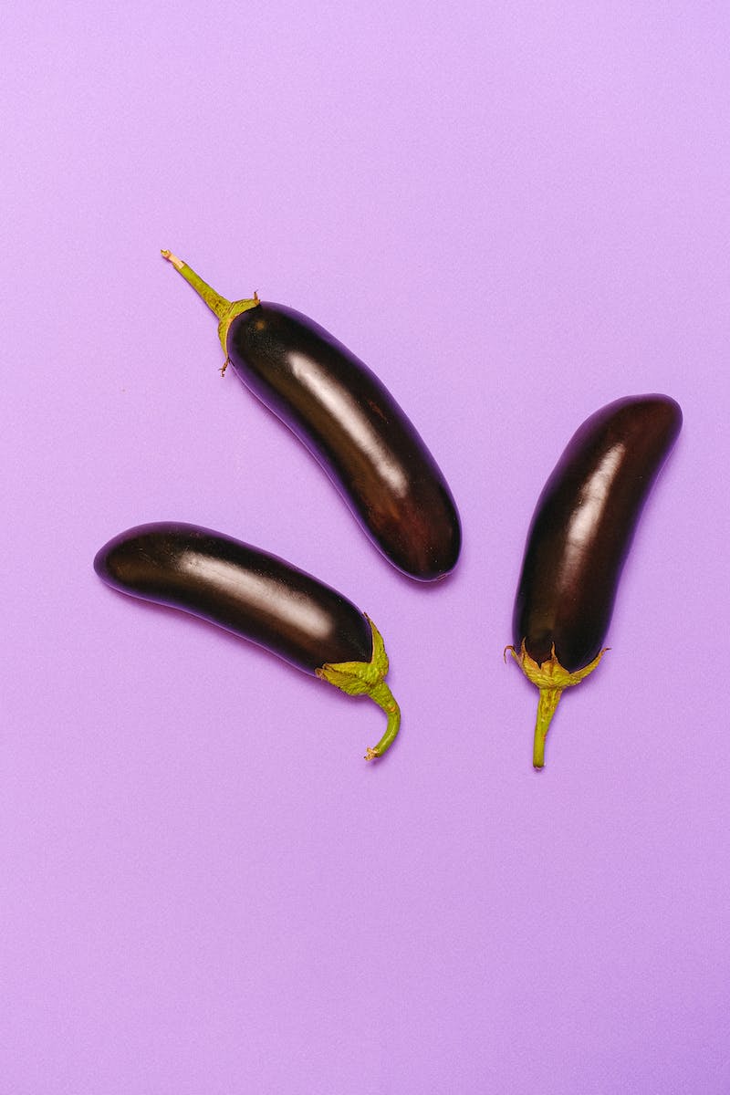 Eggplants on Light Purple Background